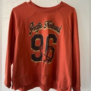 Gently used women’s small peach Pacific Northwest sweat shirt